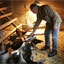 Farmer Tony Ends feeds his chickens