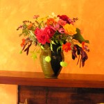 A mix of roses, zinneas, coral bean pods, and Love in a Puff A mix of roses, zinneas, coral bean pods, and Love in a Puff