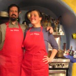 Noble and Alaine model new aprons in our hand built kitchen