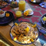 Blueberry pancakes made with Organic Blue Cornmeal and whole wheat flour...served with a protien and fruit